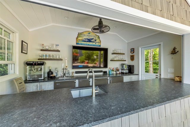 16 Dyke Rd, Setauket, NY 11733 - kitchen featuring open shelves, vaulted ceiling, dark countertops, and ornamental molding