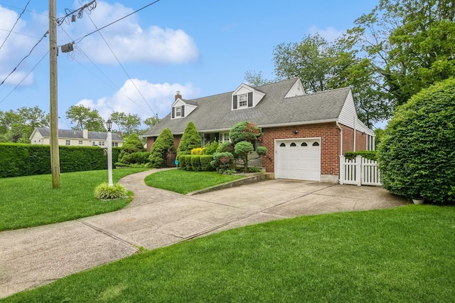 76 Roebling Pl E, Northport, NY 11731 - cape cod-style house featuring brick siding, a garage, driveway, and roof with shingles