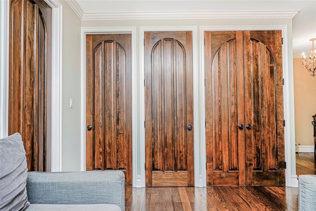 237 Eldridge St Unit 3 & 4, New York Manhattan, NY 10002 - entrance foyer with wood finished floors, crown molding, and a chandelier