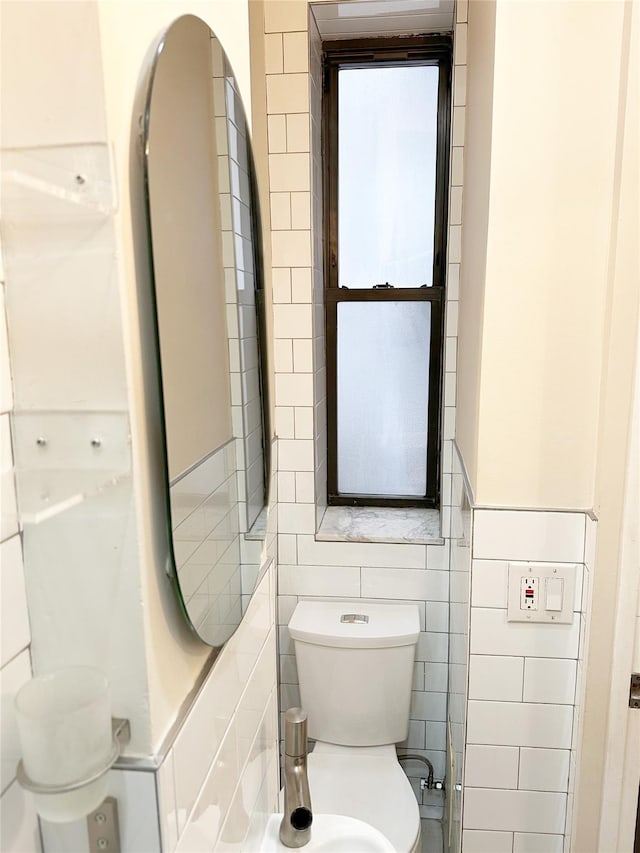 237 Eldridge St Unit 3 & 4, New York Manhattan, NY 10002 - half bathroom featuring toilet and tile walls