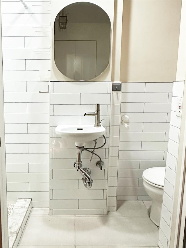 237 Eldridge St Unit 3 & 4, New York Manhattan, NY 10002 - bathroom with tile walls, tile patterned flooring, and a shower