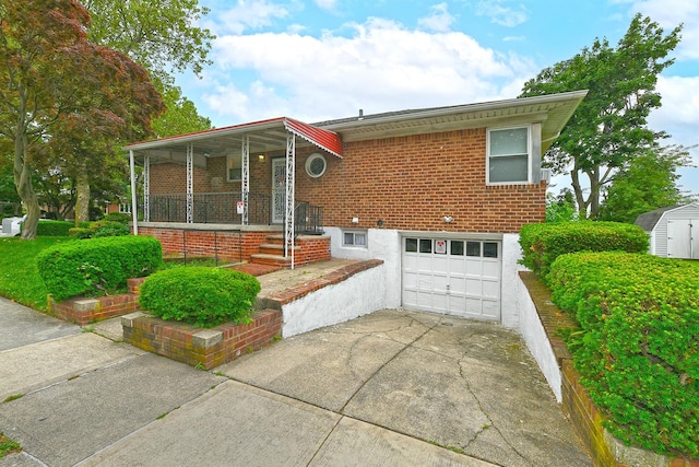 169-04 69th Ave, Fresh Meadows, NY 11365 - view of front of property with an attached garage, driveway, covered porch, brick siding, and a shed