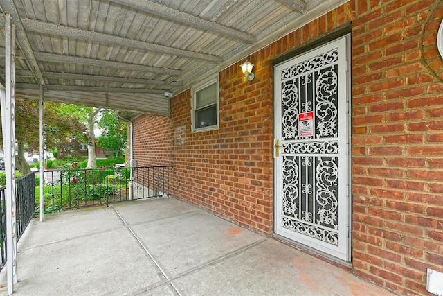 169-04 69th Ave, Fresh Meadows, NY 11365 - entrance to property with brick siding and covered porch