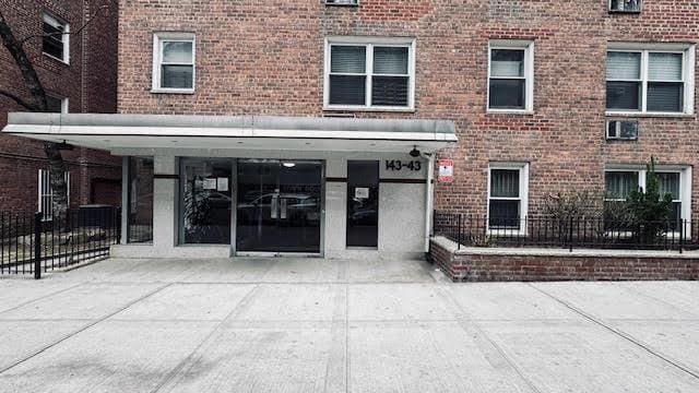 143-43 41 Unit 5C, Flushing, NY 11355 - entrance to property featuring brick siding
