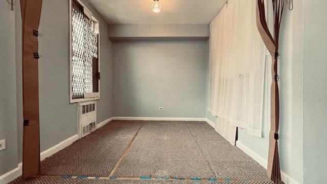 143-43 41 Unit 5C, Flushing, NY 11355 - unfurnished bedroom featuring carpet flooring and radiator heating unit