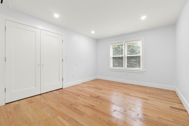 22019 135th Ave, Addisleigh Park, NY 11413 - unfurnished bedroom featuring light wood-type flooring, recessed lighting, and a closet