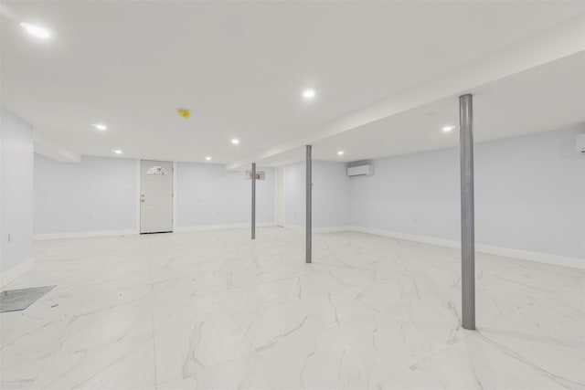 22019 135th Ave, Addisleigh Park, NY 11413 - finished below grade area with a wall unit AC, recessed lighting, and light marble finish flooring