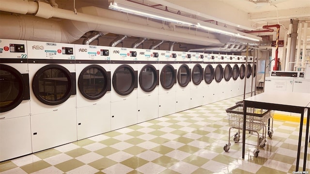 142-05 Roosevelt Ave Unit 721, Flushing, NY 11354 - community laundry room with independent washer and dryer and tile patterned floors