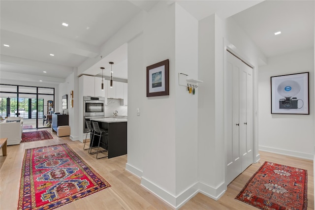 100 Pondfield Rd Unit 2B, Bronxville, NY 10708 - hall featuring light wood-style flooring and recessed lighting