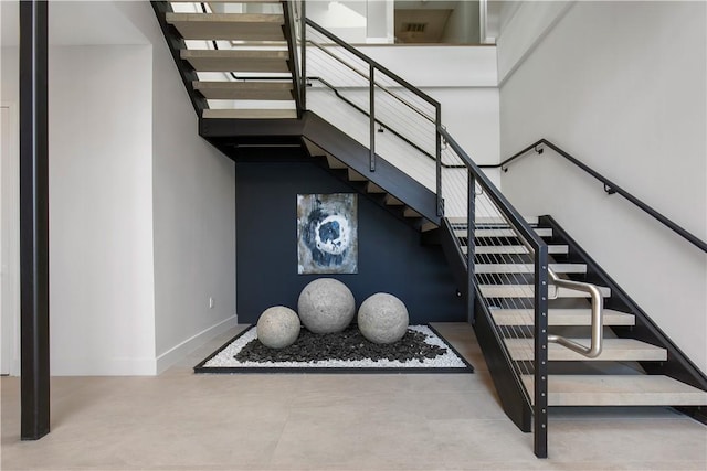100 Pondfield Rd Unit 2B, Bronxville, NY 10708 - stairs featuring baseboards