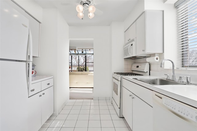 1374 Midland Ave Unit Ph07, Bronxville, NY 10708 - kitchen with white appliances, plenty of natural light, light countertops, and white cabinetry