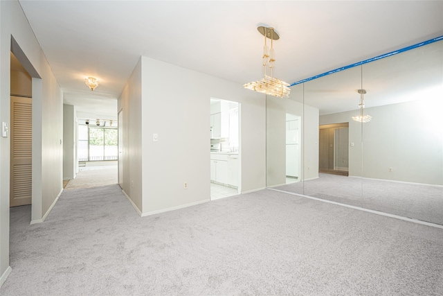 1374 Midland Ave Unit Ph07, Bronxville, NY 10708 - unfurnished room featuring light colored carpet and a chandelier