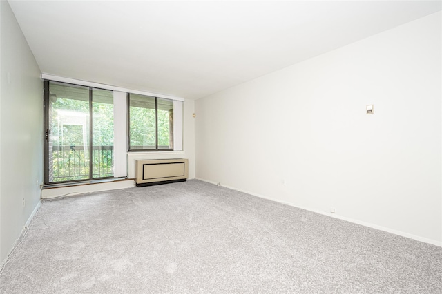 1374 Midland Ave Unit Ph07, Bronxville, NY 10708 - unfurnished living room featuring carpet floors and baseboards