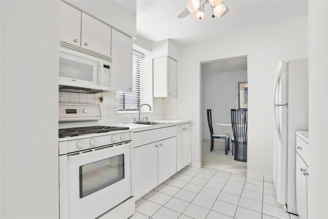 1374 Midland Ave Unit Ph07, Bronxville, NY 10708 - kitchen with white appliances, light countertops, white cabinets, backsplash, and a ceiling fan