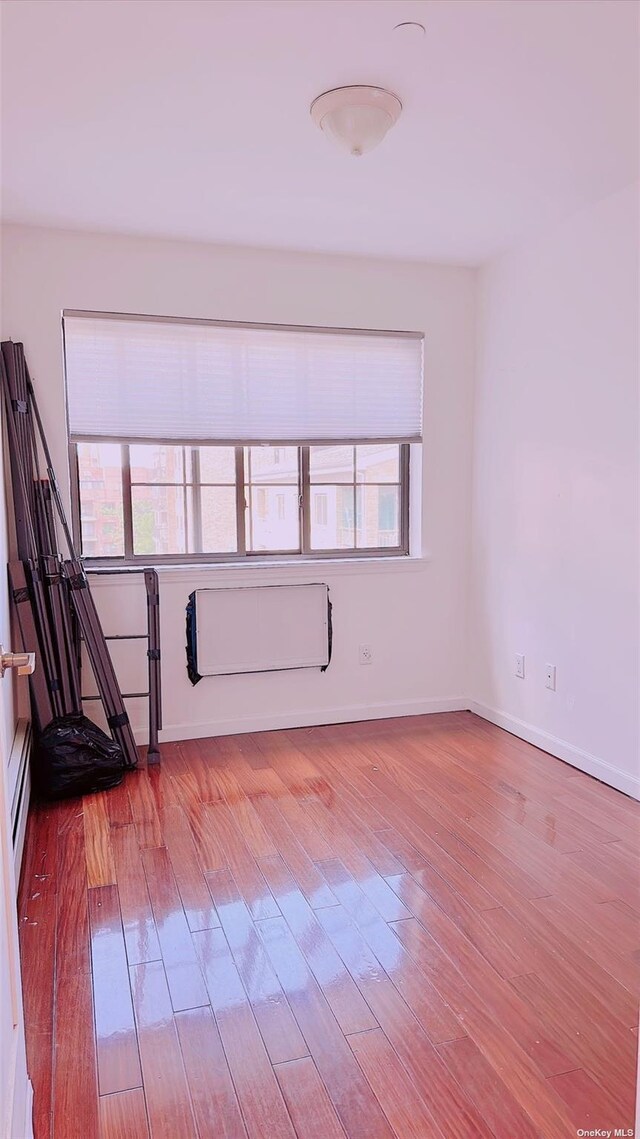 144-85 Roosevelt Ave Unit 5E, Flushing, NY 11354 - empty room with wood finished floors