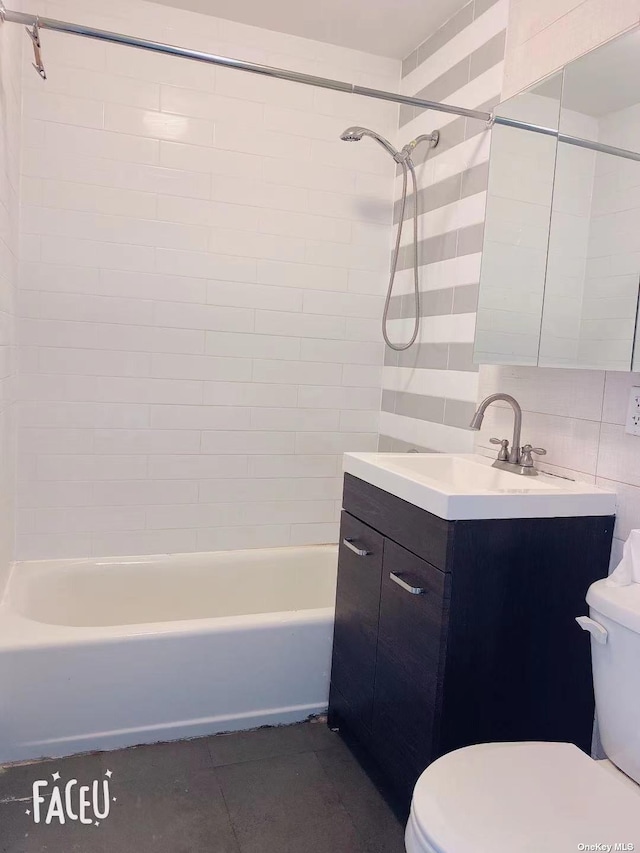 144-85 Roosevelt Ave Unit 5E, Flushing, NY 11354 - bathroom featuring vanity, washtub / shower combination, tile patterned floors, and tile walls