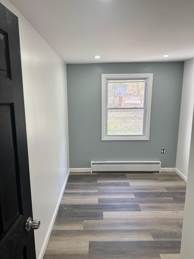 6 Hillcrest Trl, Monroe, NY 10950 - spare room with a baseboard heating unit, recessed lighting, and wood finished floors
