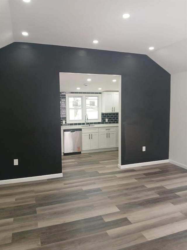 6 Hillcrest Trl, Monroe, NY 10950 - unfurnished living room featuring vaulted ceiling, recessed lighting, and light wood-style flooring