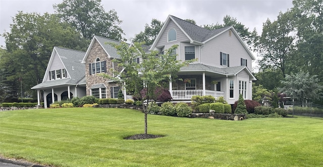 5 Odell Dr, Stony Point, NY 10980 - view of front of property with stone siding, a porch, and a shingled roof
