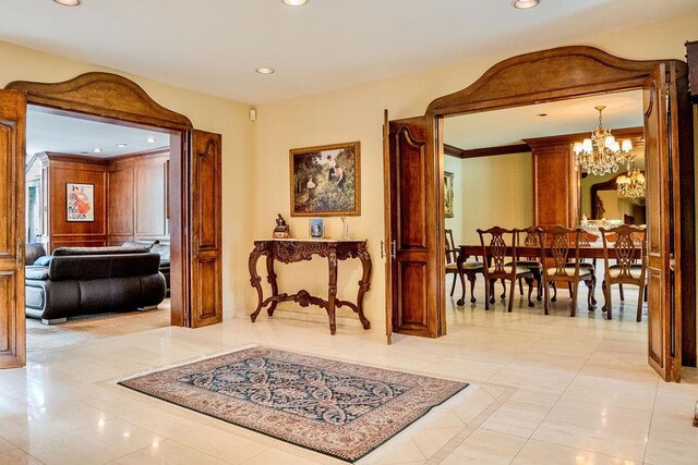 14 Pine Dr, Woodbury, NY 11797 - corridor featuring a chandelier, recessed lighting, and light tile patterned flooring