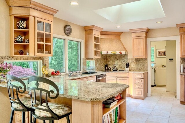 14 Pine Dr, Woodbury, NY 11797 - kitchen with premium range hood, light brown cabinets, backsplash, a peninsula, and light stone countertops