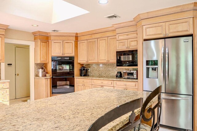 14 Pine Dr, Woodbury, NY 11797 - kitchen featuring black appliances, light brown cabinets, tasteful backsplash, light stone countertops, and recessed lighting