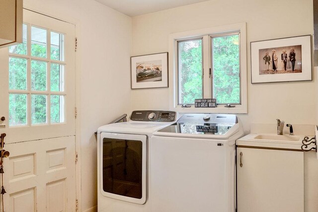 14 Pine Dr, Woodbury, NY 11797 - laundry room featuring washing machine and dryer and plenty of natural light