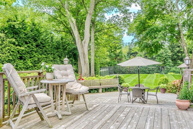 14 Pine Dr, Woodbury, NY 11797 - deck featuring outdoor dining space and view of wooded area