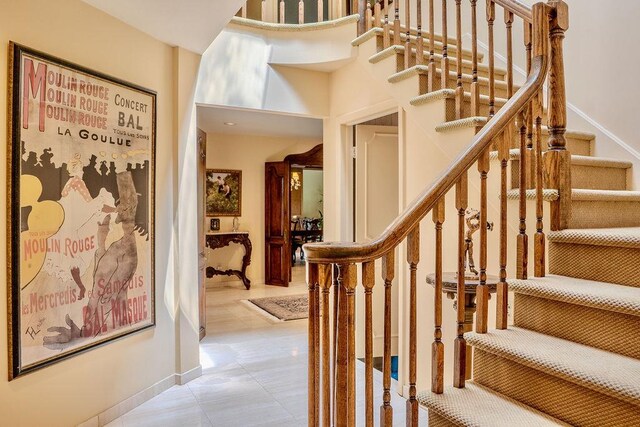 14 Pine Dr, Woodbury, NY 11797 - stairway featuring baseboards and tile patterned floors