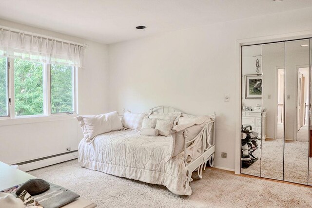 14 Pine Dr, Woodbury, NY 11797 - carpeted bedroom with a baseboard heating unit