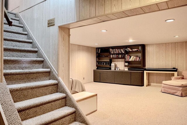 14 Pine Dr, Woodbury, NY 11797 - staircase featuring wood walls, carpet flooring, and recessed lighting