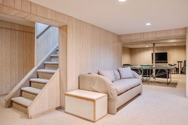 14 Pine Dr, Woodbury, NY 11797 - carpeted living room with stairway, wood walls, and recessed lighting