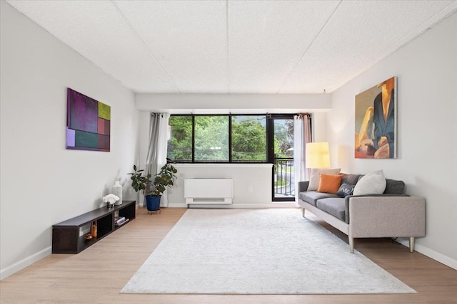 66 Crisfield St Unit 2B, Yonkers, NY 10710 - living room with light wood-style floors and baseboards