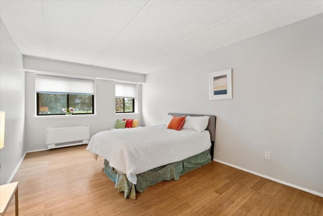 66 Crisfield St Unit 2B, Yonkers, NY 10710 - bedroom featuring wood finished floors and radiator
