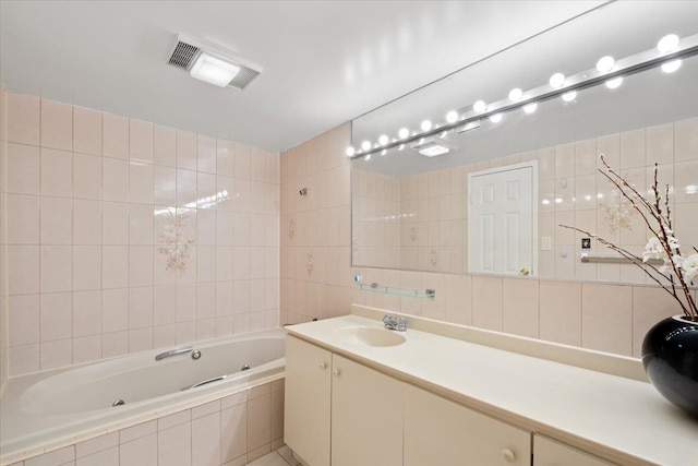 66 Crisfield St Unit 2B, Yonkers, NY 10710 - bathroom featuring tile walls, a jetted tub, vanity, and tasteful backsplash
