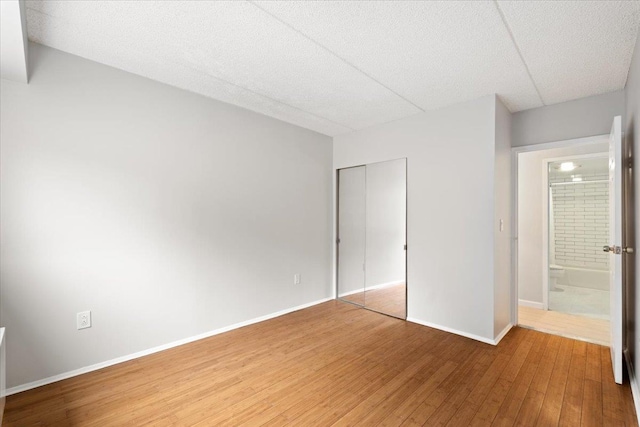 66 Crisfield St Unit 2B, Yonkers, NY 10710 - unfurnished bedroom with wood finished floors and a closet
