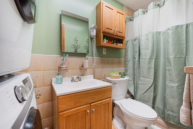 42 S Montague St, Valley Stream, NY 11580 - full bath featuring washer / clothes dryer, tile walls, vanity, wainscoting, and a shower with curtain