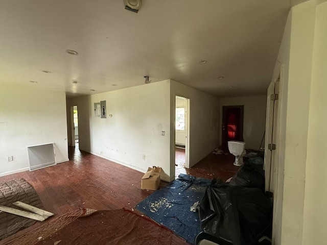 788 Dean Dr, Baldwin, NY 11510 - unfurnished living room with wood finished floors and electric panel