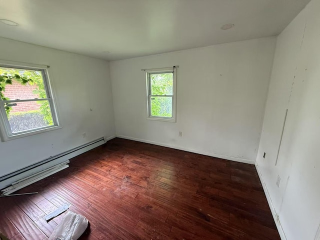 788 Dean Dr, Baldwin, NY 11510 - spare room featuring a baseboard radiator and hardwood / wood-style floors