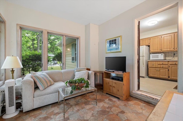 241 Hampton St, East Hampton, NY 11963 - living room with light stone finish flooring