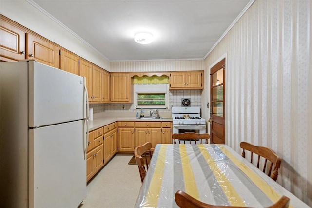 241 Hampton St, East Hampton, NY 11963 - kitchen with white appliances, ornamental molding, light countertops, wallpapered walls, and light colored carpet
