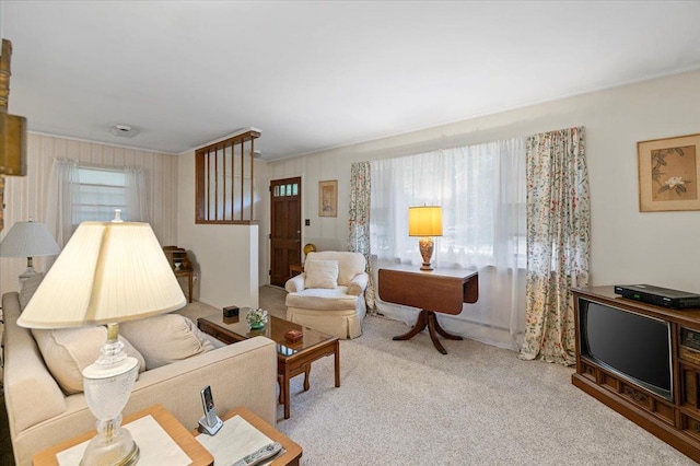241 Hampton St, East Hampton, NY 11963 - carpeted living area with crown molding