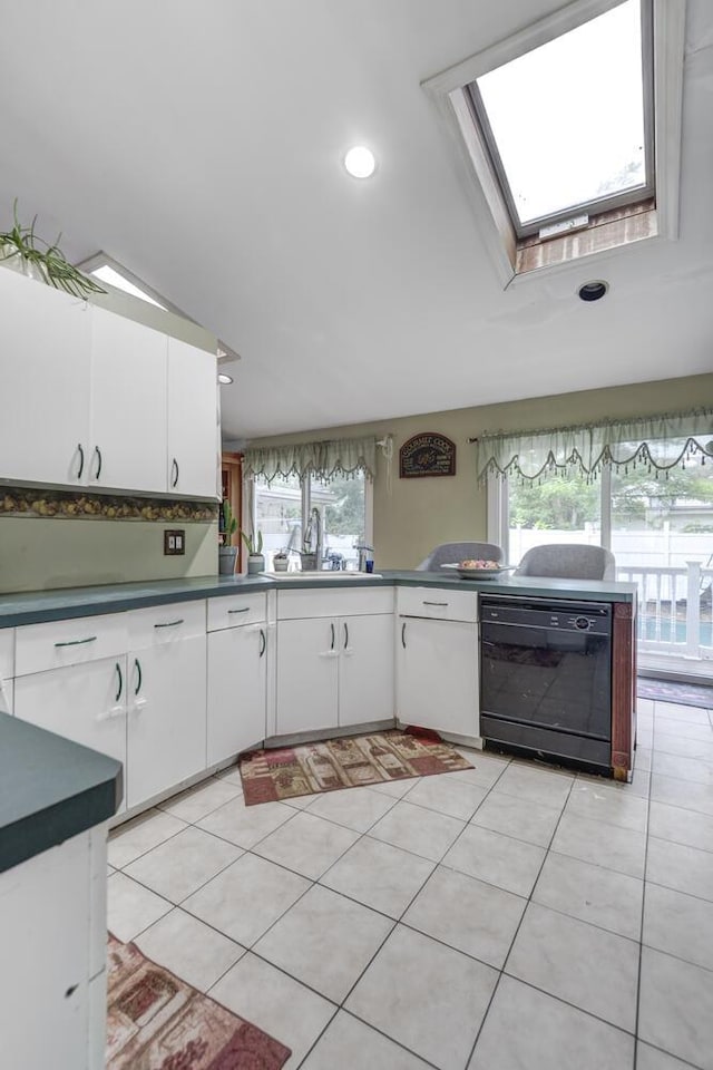 1464 Potter Blvd, Bay Shore, NY 11706 - kitchen featuring black dishwasher, white cabinets, light tile patterned flooring, and recessed lighting