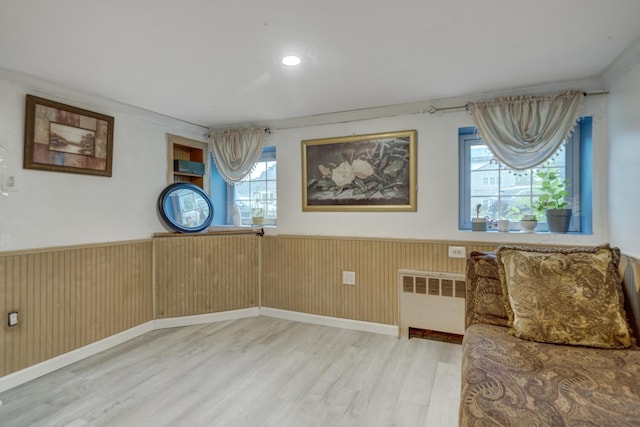 1464 Potter Blvd, Bay Shore, NY 11706 - unfurnished room with radiator, wainscoting, wood finished floors, and plenty of natural light