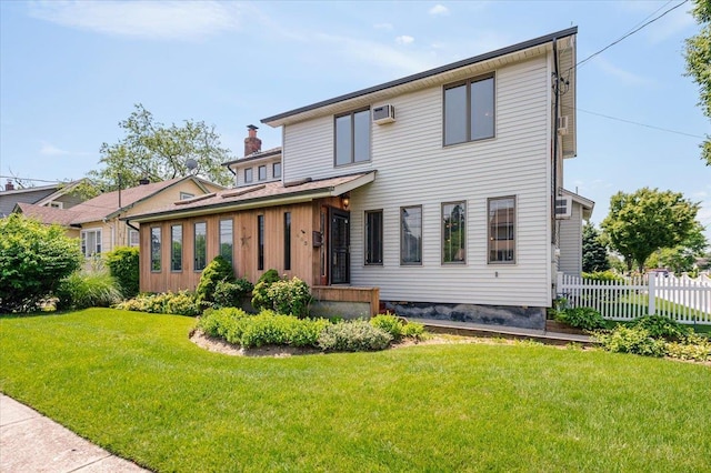 403 S 1st St, Lindenhurst, NY 11757 - view of front facade featuring a chimney and a wall mounted air conditioner