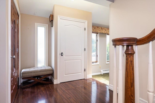 403 S 1st St, Lindenhurst, NY 11757 - entrance foyer featuring a baseboard radiator and dark wood-style floors