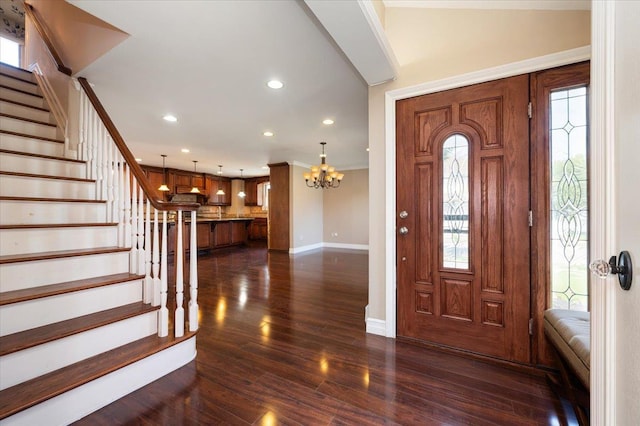 403 S 1st St, Lindenhurst, NY 11757 - foyer entrance with stairs, a chandelier, dark wood-style flooring, recessed lighting, and crown molding