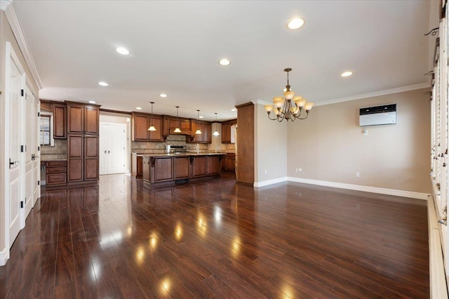 403 S 1st St, Lindenhurst, NY 11757 - kitchen with a chandelier, ornamental molding, brown cabinets, backsplash, and a kitchen island