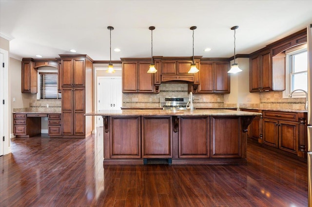 403 S 1st St, Lindenhurst, NY 11757 - kitchen featuring stove, backsplash, built in desk, dark wood finished floors, and recessed lighting