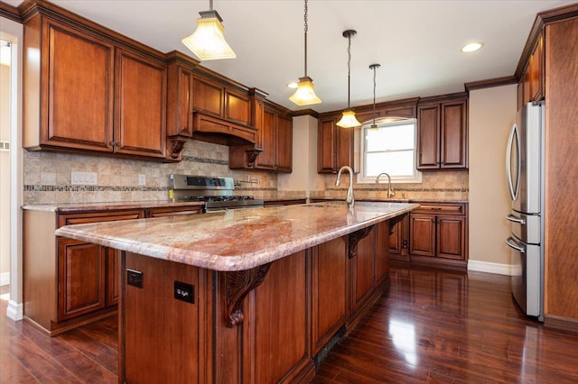 403 S 1st St, Lindenhurst, NY 11757 - kitchen with stainless steel appliances, dark wood finished floors, a center island with sink, light stone counters, and backsplash